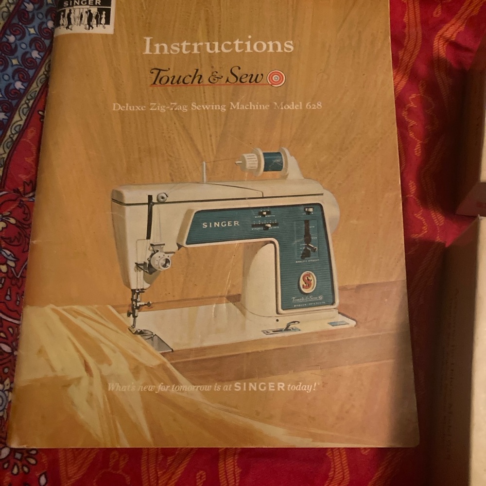 Vintage Red and Blue Sewing Machine Manual